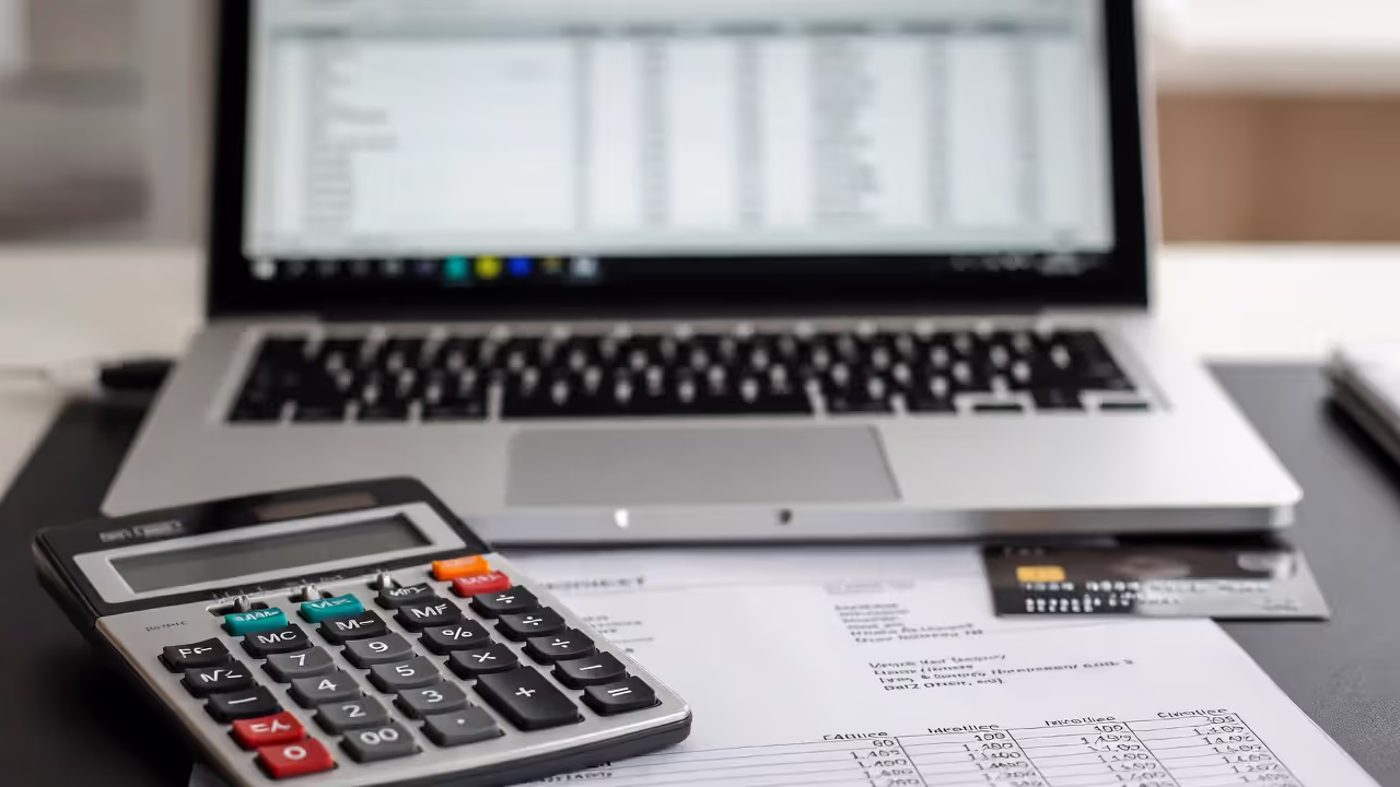 Invoice and calculator illustrating service agreement payment terms